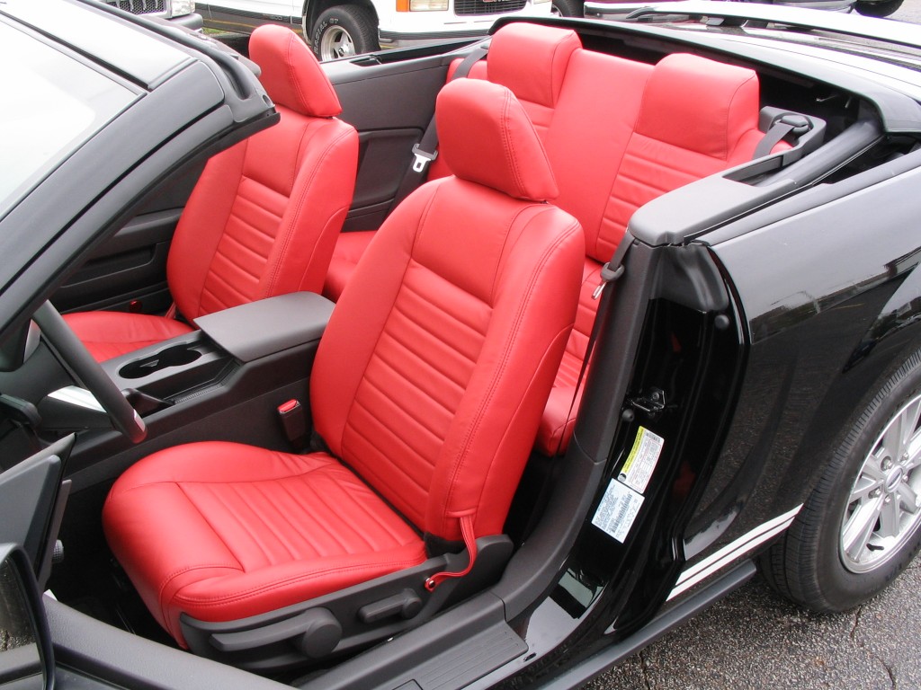 Convertible car seats reupholstered in red leather